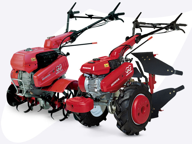 Motor-cultivator en achtertrekker