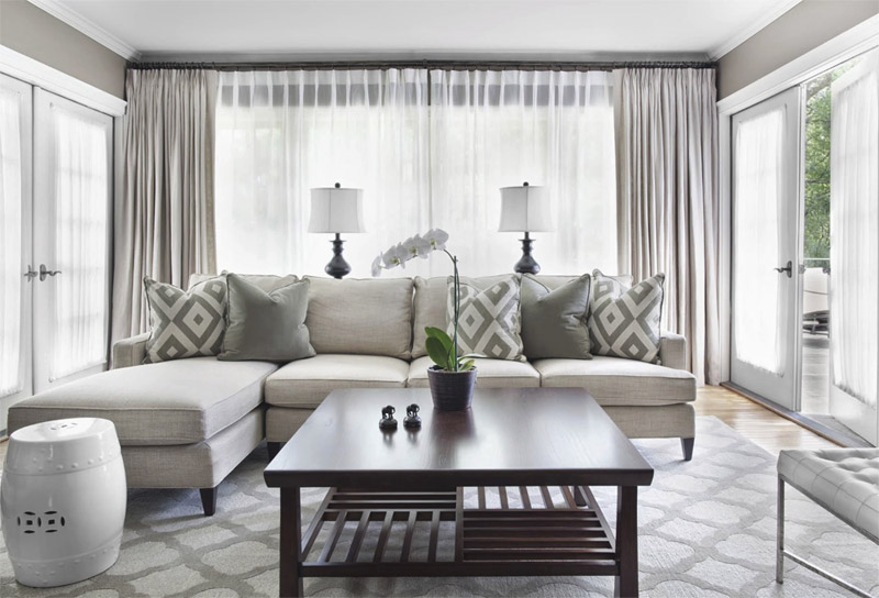 Modern living room in white, gray and green colors.